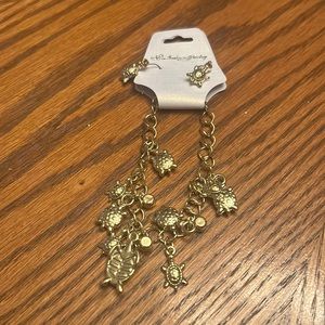 NWT WOMEN FAUX GOLDTONE PIERCED DANGLING TURTLE EARRING AND BRACELET SET.